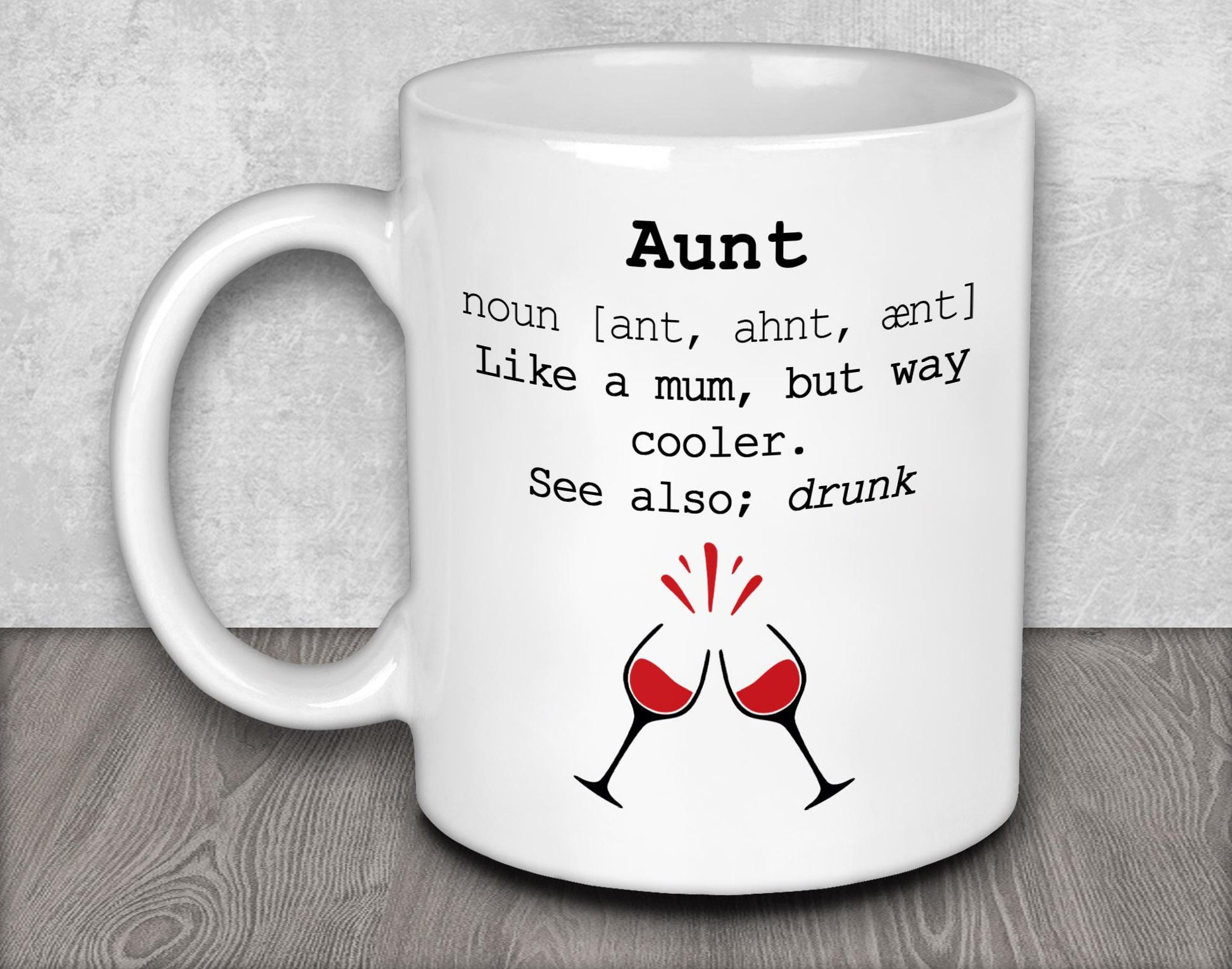 a white coffee mug with two glasses of wine on it