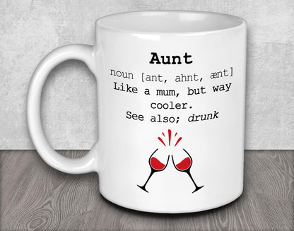 a white coffee mug with two glasses of wine on it