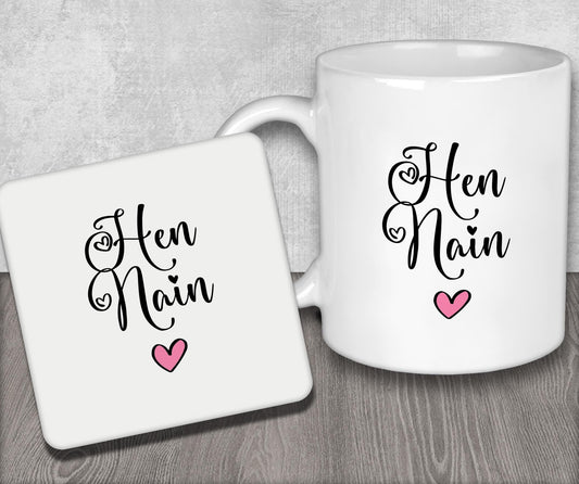 a couple of coffee mugs sitting on top of a wooden table