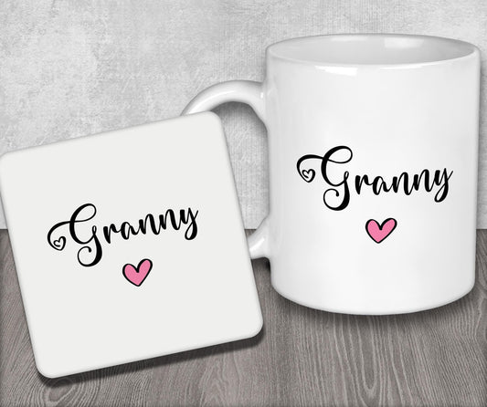 a couple of white coffee mugs sitting on top of a wooden table