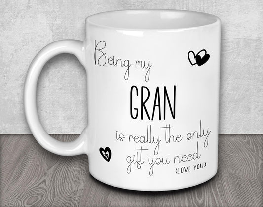 a white coffee mug with the words being my gran is really the only gift you