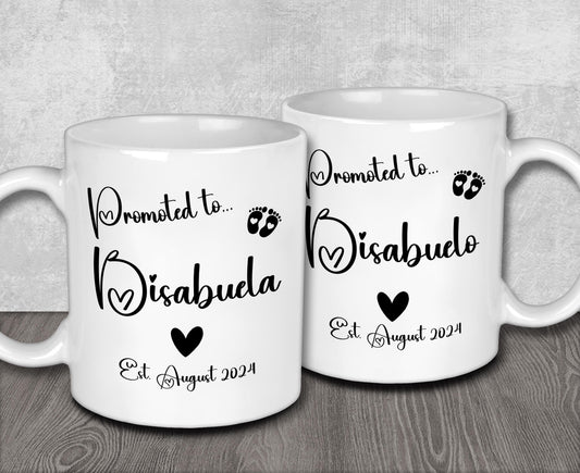 a couple of white coffee mugs sitting on top of a wooden table