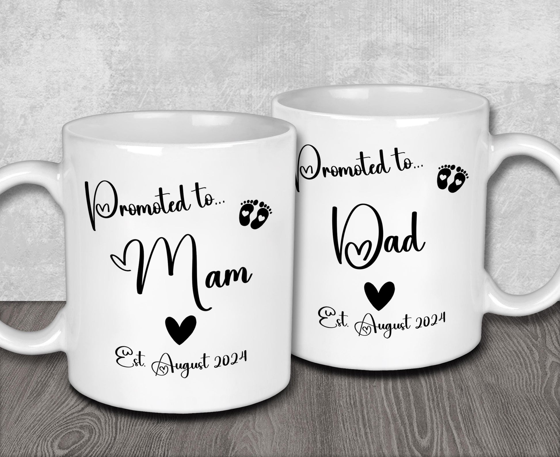 a couple of white coffee mugs sitting on top of a wooden table