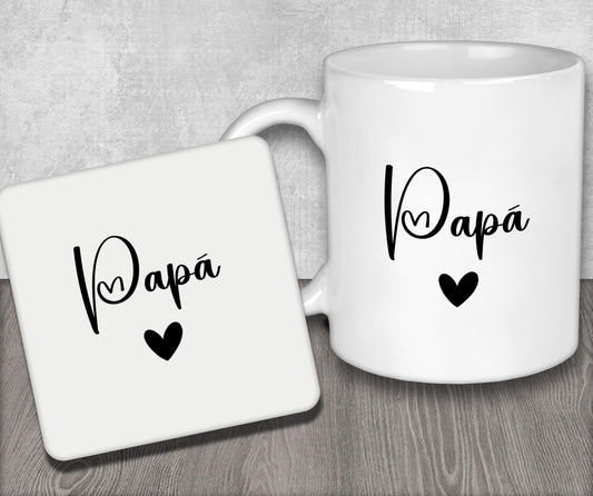 a couple of white coffee mugs sitting on top of a wooden table