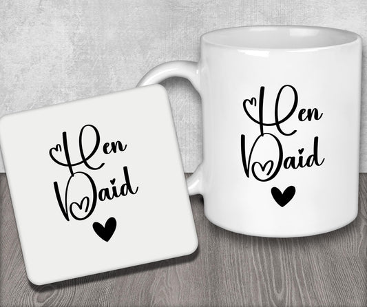 a couple of coffee mugs sitting on top of a wooden table