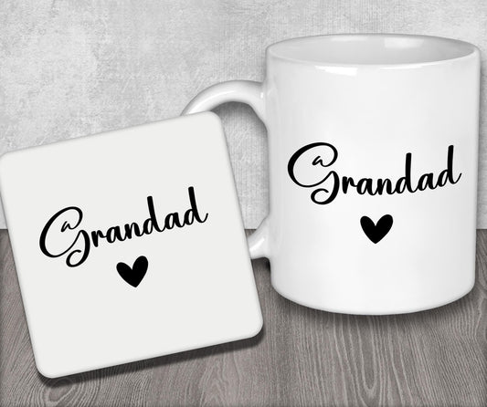 a couple of white coffee mugs sitting on top of a wooden table