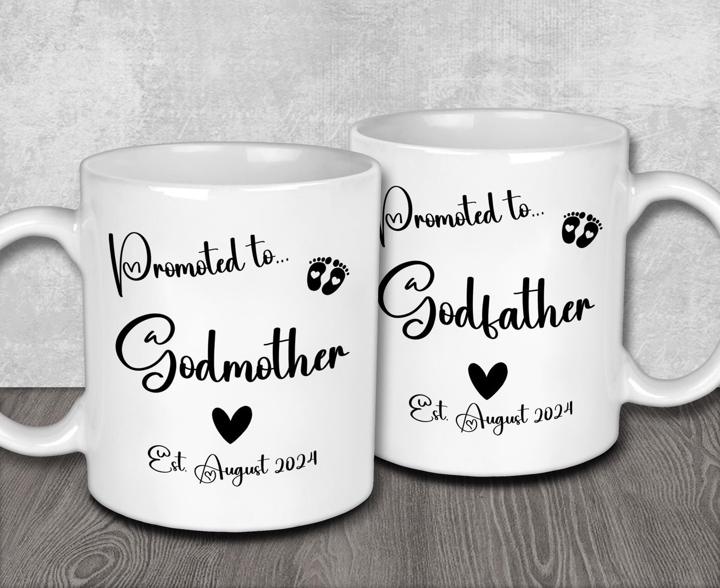 two white coffee mugs sitting on top of a wooden table