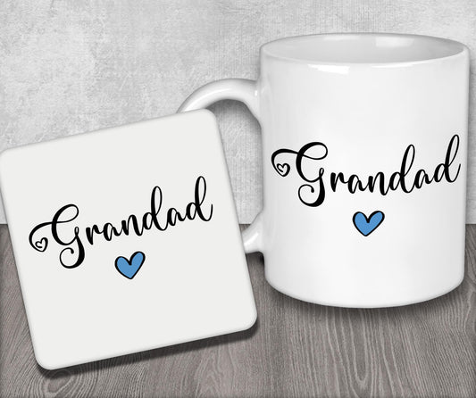 a white coffee mug sitting next to a coaster