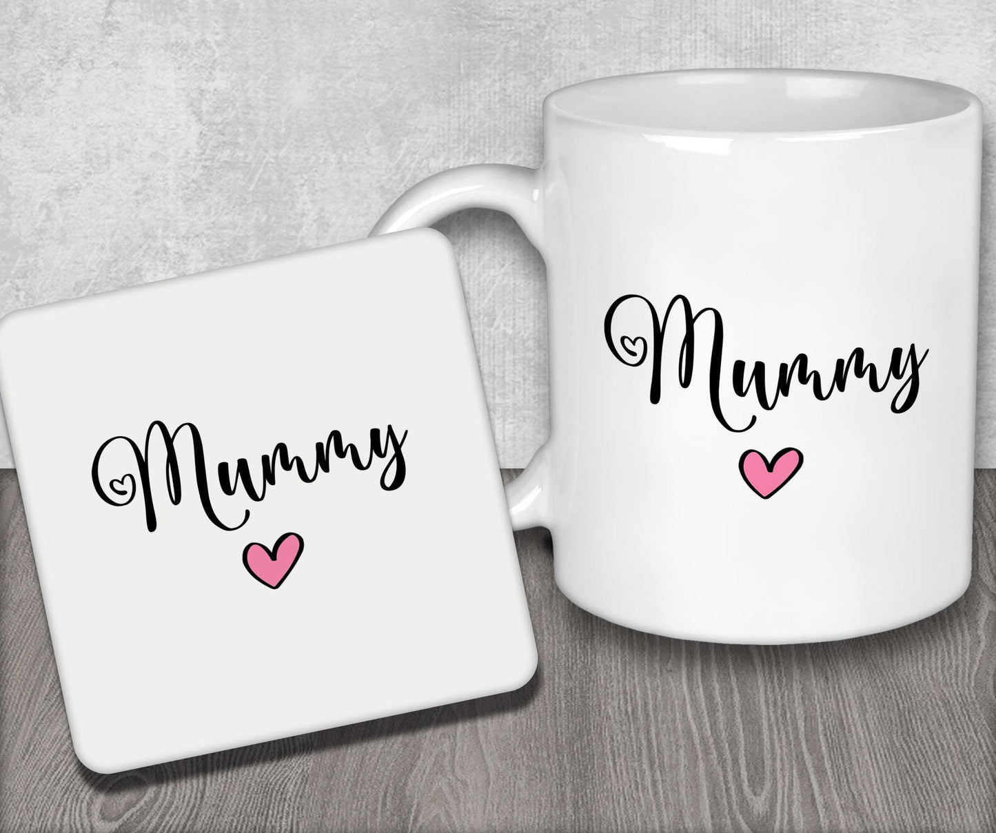 a white coffee mug with a pink heart on it