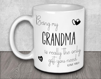 a white coffee mug with the words being my grandma is really the only gift you