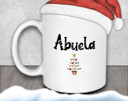A white mug with the word &quot;Abuela&quot; printed on it, along with a Christmas tree design.
