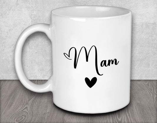 a white coffee mug with a black heart on it