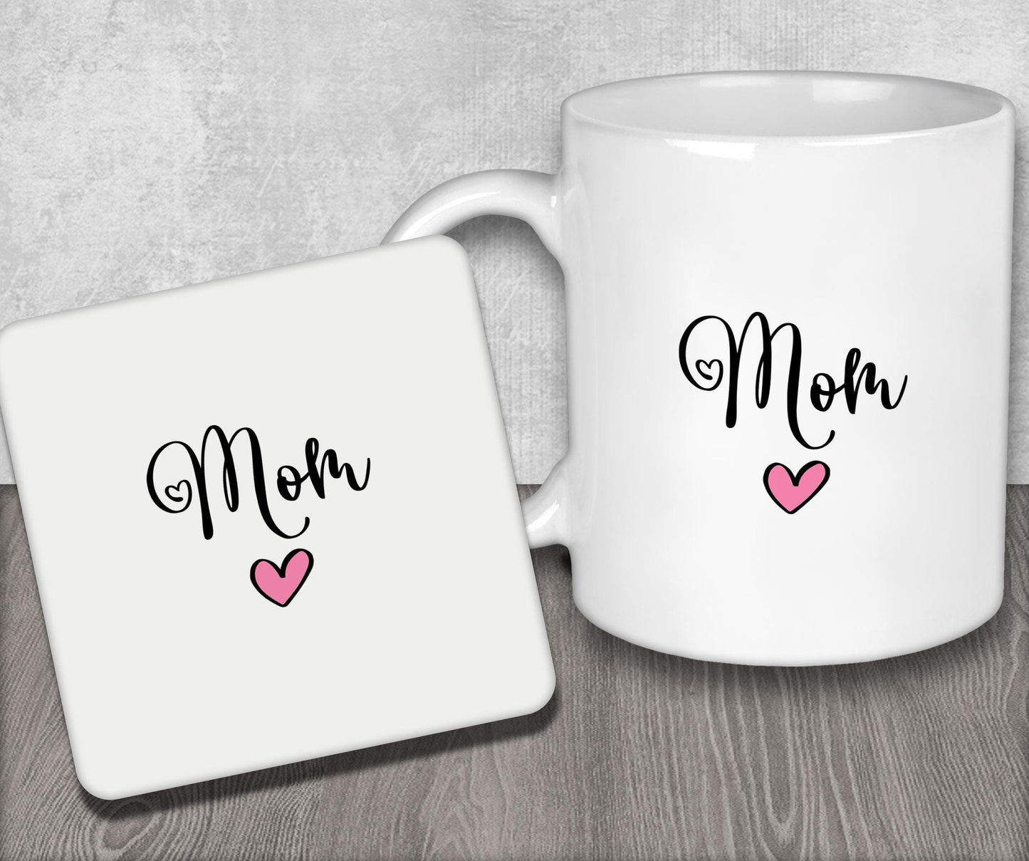 a white coffee mug with the word mom on it