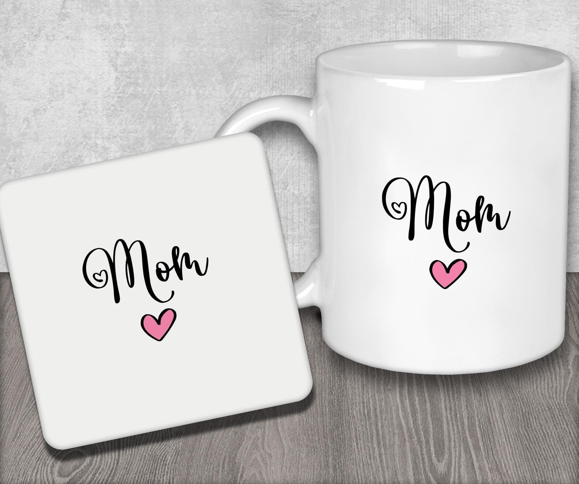 a white coffee mug with the word mom on it