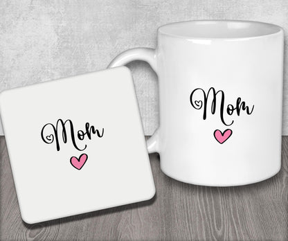 a white coffee mug with the word mom on it
