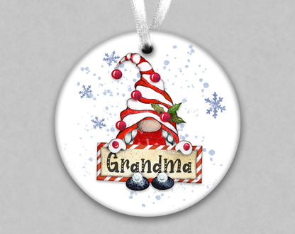 A white ornament with a gnome design and the word &quot;Grandma&quot; written on it.