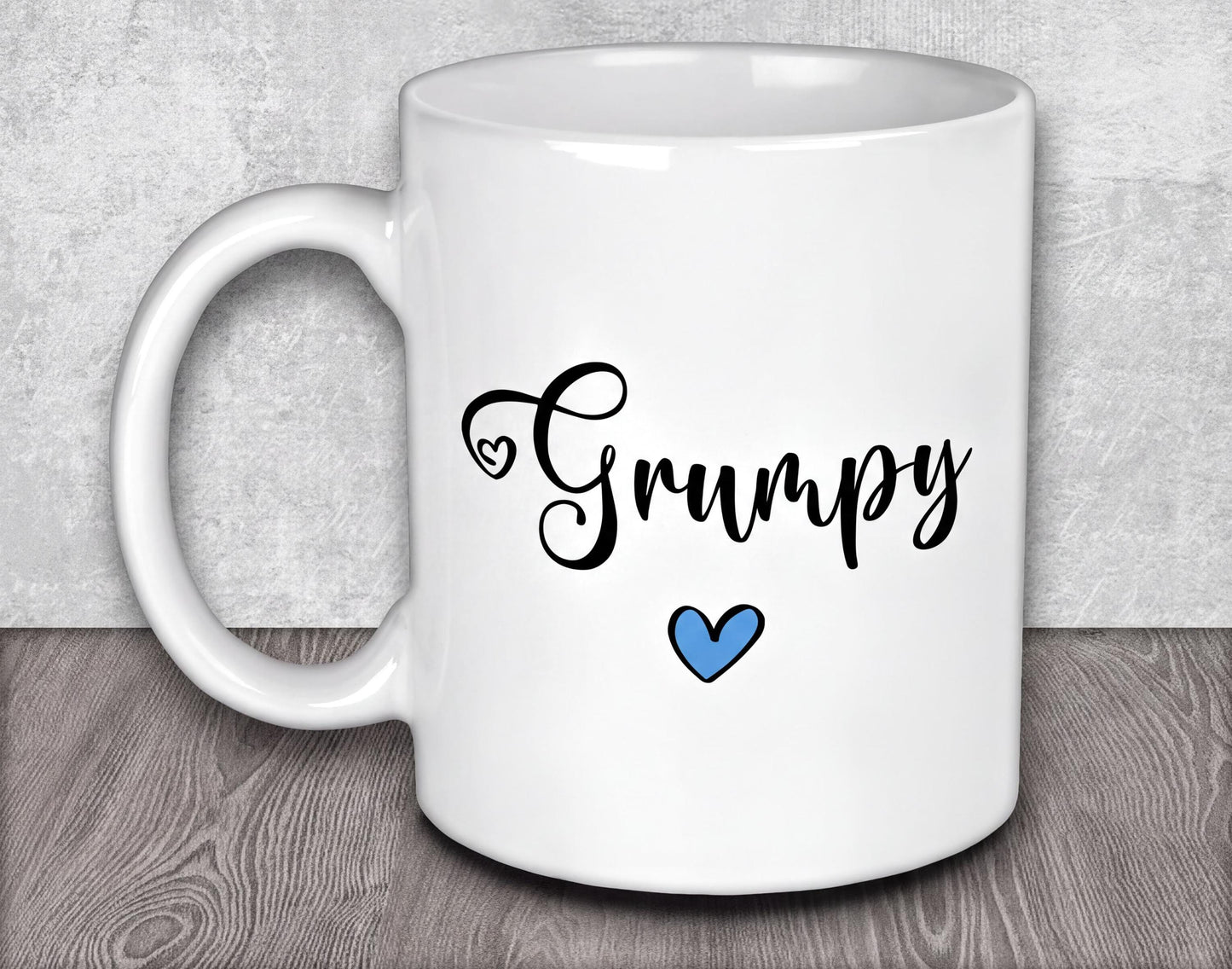 a white coffee mug with a blue heart on it