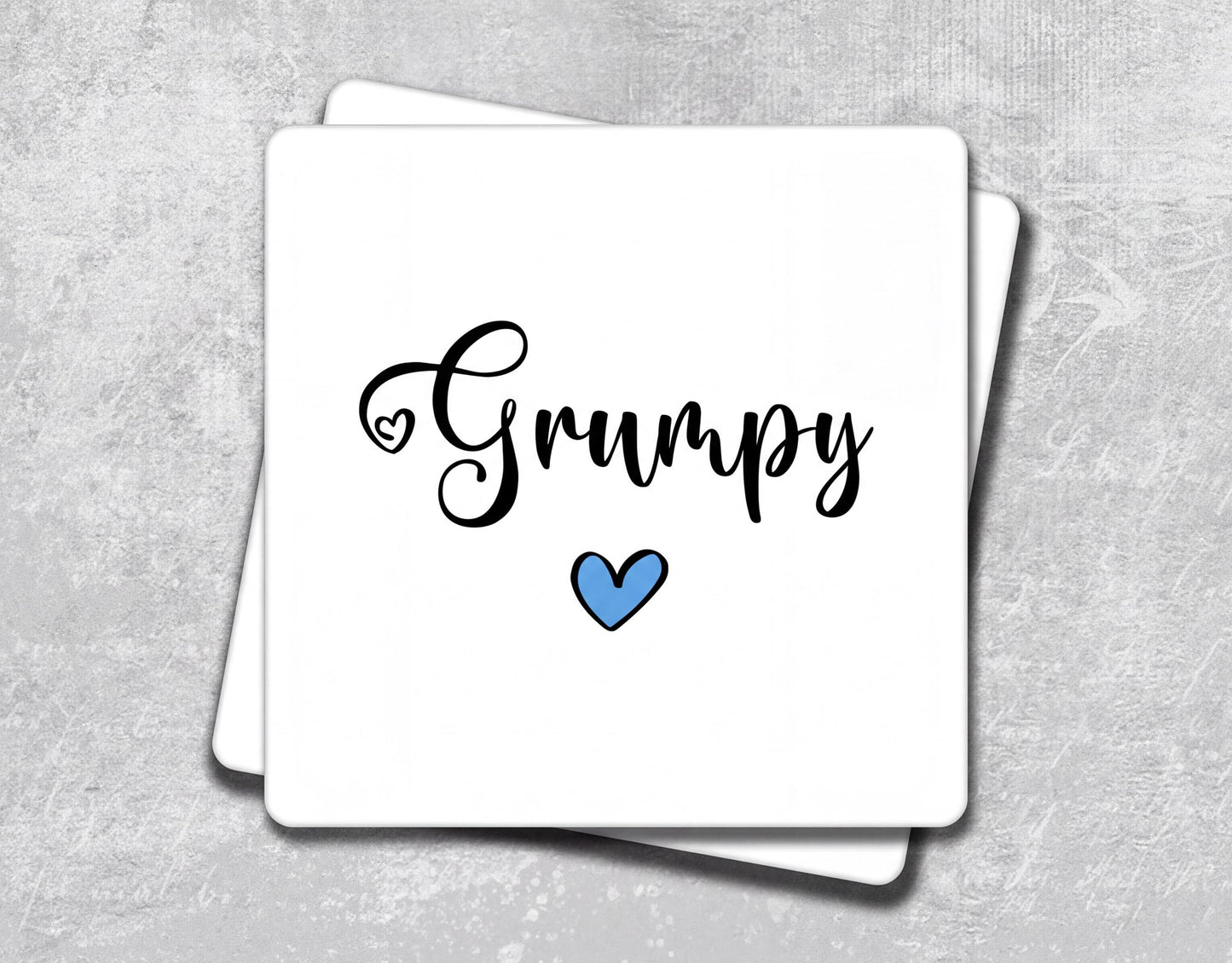 a white card with the word's name and a blue heart on it