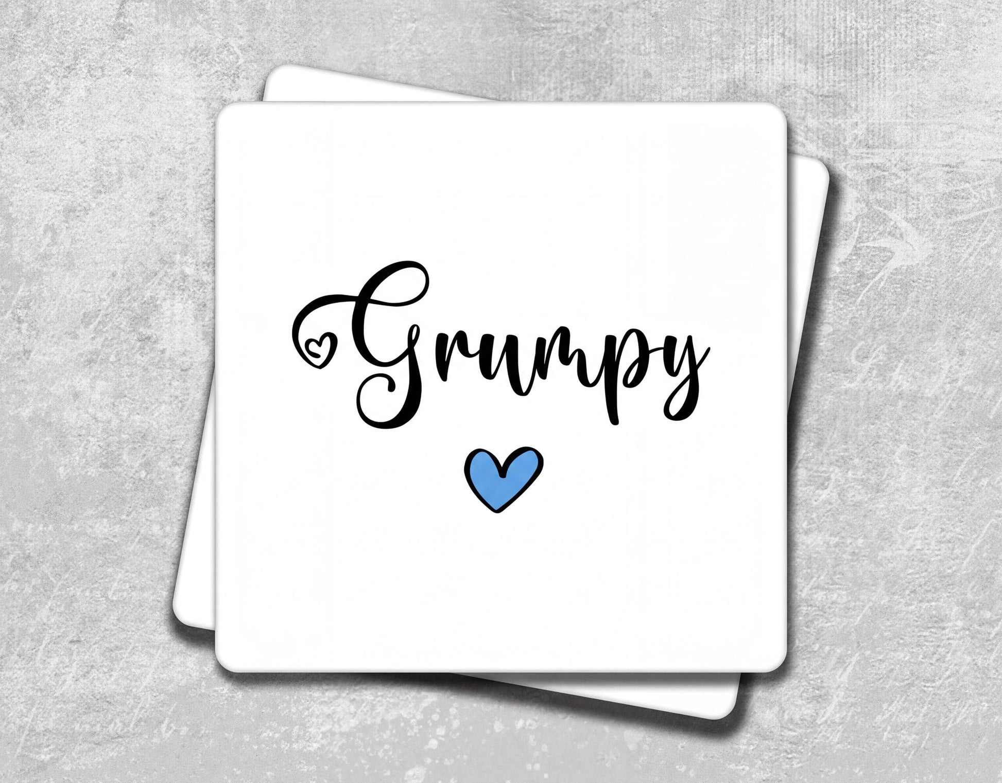 a white card with the word's name and a blue heart on it