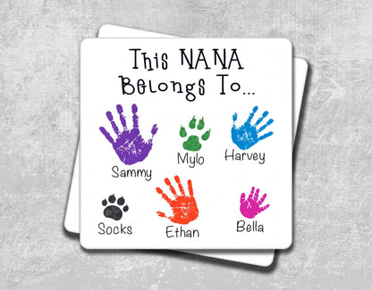The image is a personalized family tree with handprints and animal paw prints, each representing a family member.