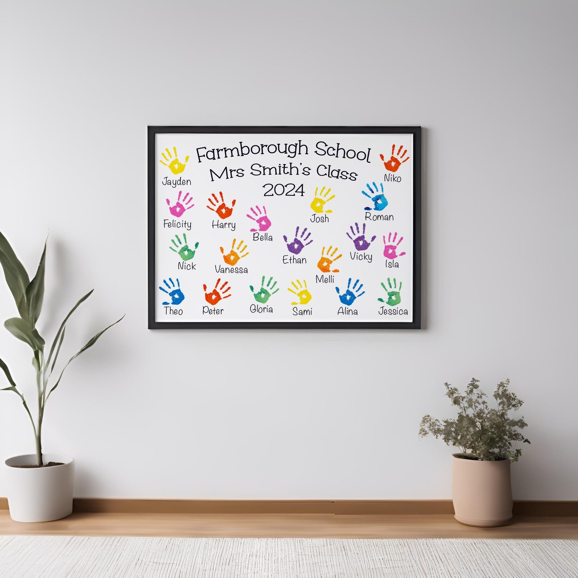 The image is a framed wall hanging with a list of names and handprints, likely representing the students in a class at Farmborough School.
