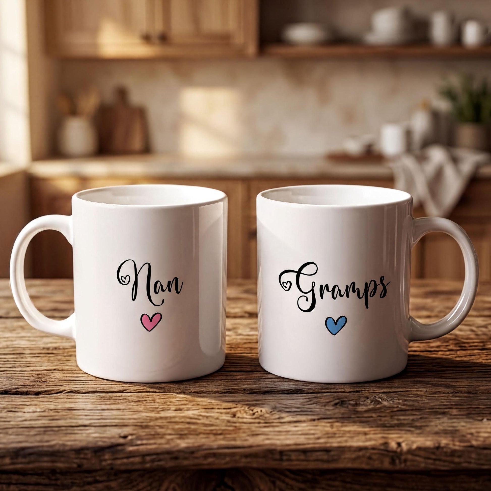 Two white mugs with personalized names and hearts on them, placed on a wooden surface.