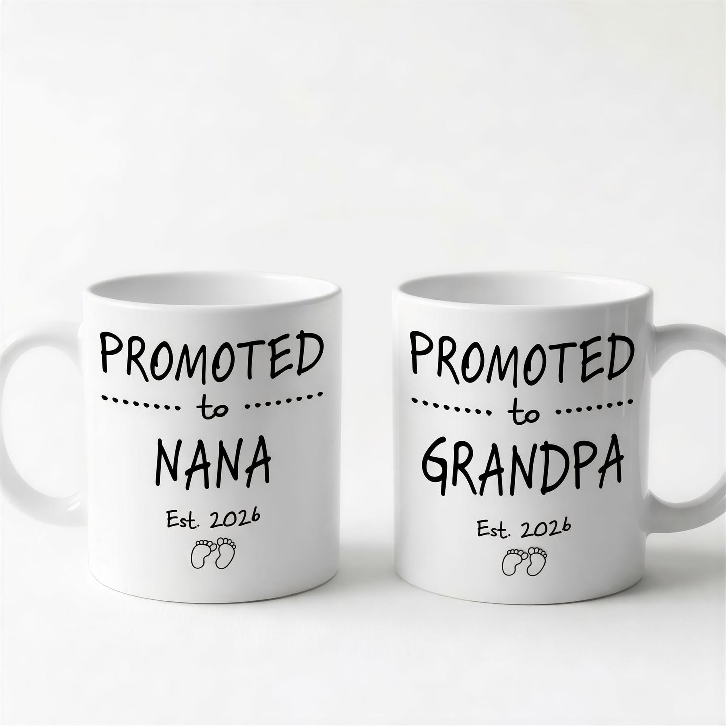 Two white ceramic mugs with black text and graphics printed on them.