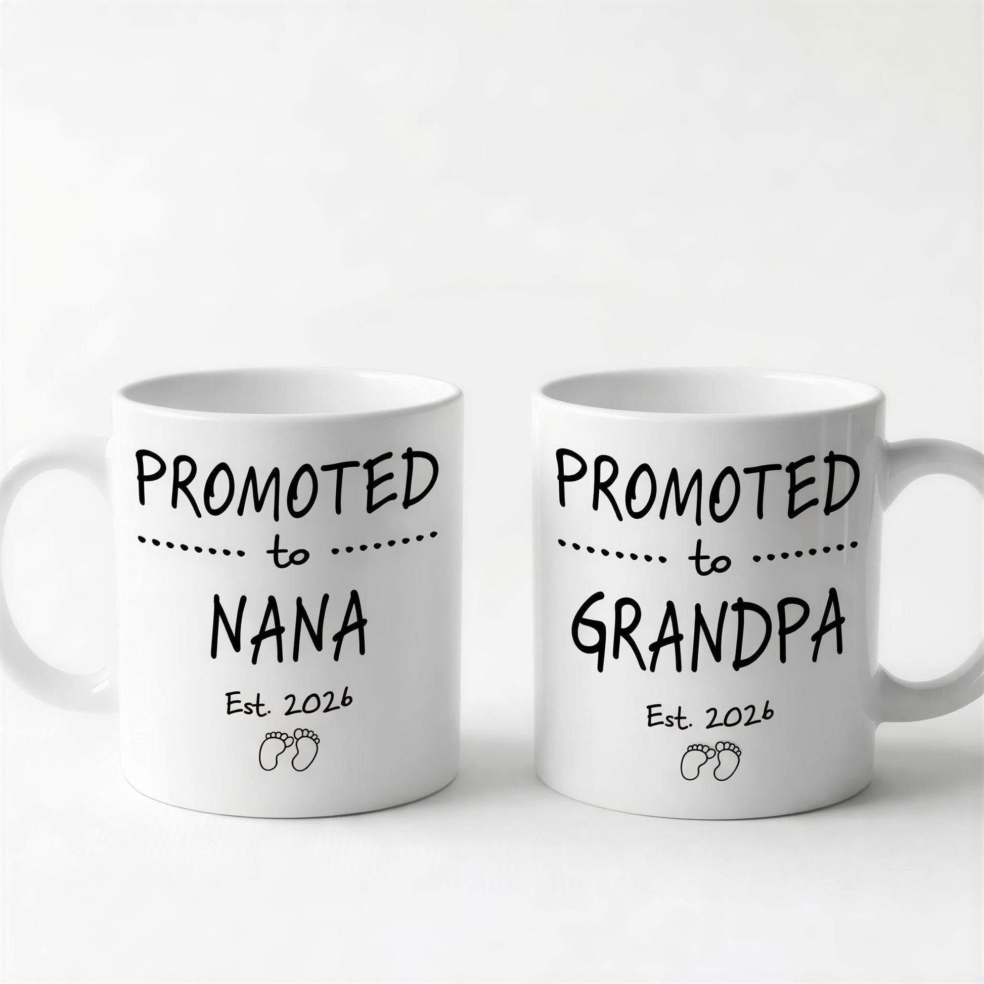 Two white ceramic mugs with black text and graphics printed on them.
