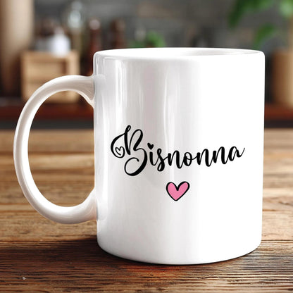 A white ceramic mug with the word "Bisnonna" written on it, along with a small pink heart symbol.