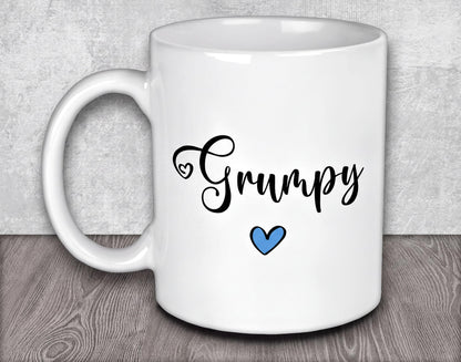 a white coffee mug with a blue heart on it