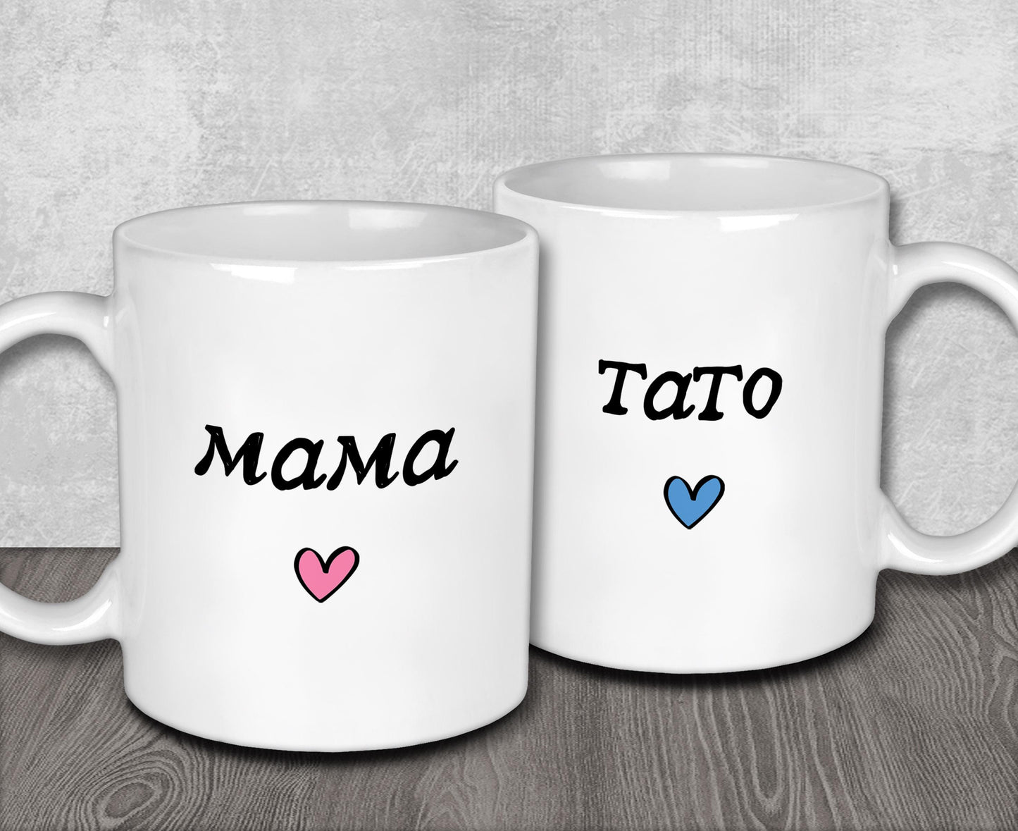 two white coffee mugs with the words mama and tato on them