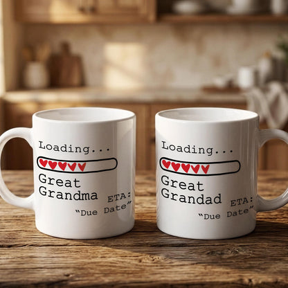Two white mugs with text and graphics on them, placed on a wooden surface.