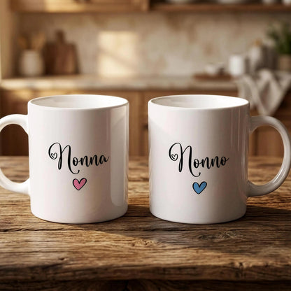 Two white mugs with the name "Nonna" and a heart symbol printed on them, placed on a wooden surface.