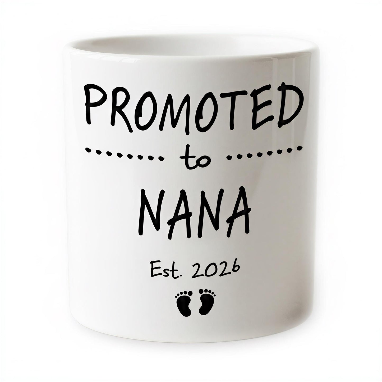 The image is a white ceramic mug with black text and footprint graphics.