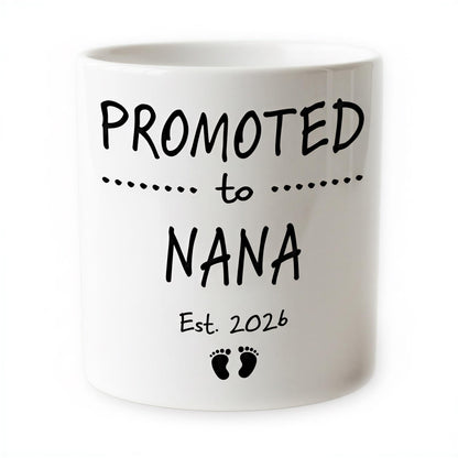 The image is a white ceramic mug with black text and footprint graphics.