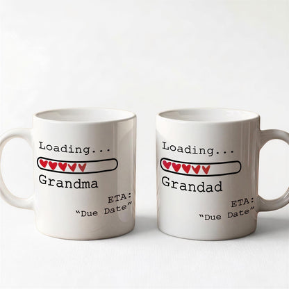 Two white ceramic mugs with text and graphics on them.