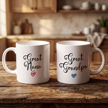 Two white mugs with black text and heart symbols, placed on a wooden surface.