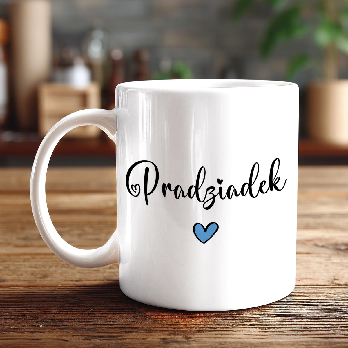 A white ceramic mug with the Polish phrase "Przęzdęk" printed on it, along with a small blue heart symbol.