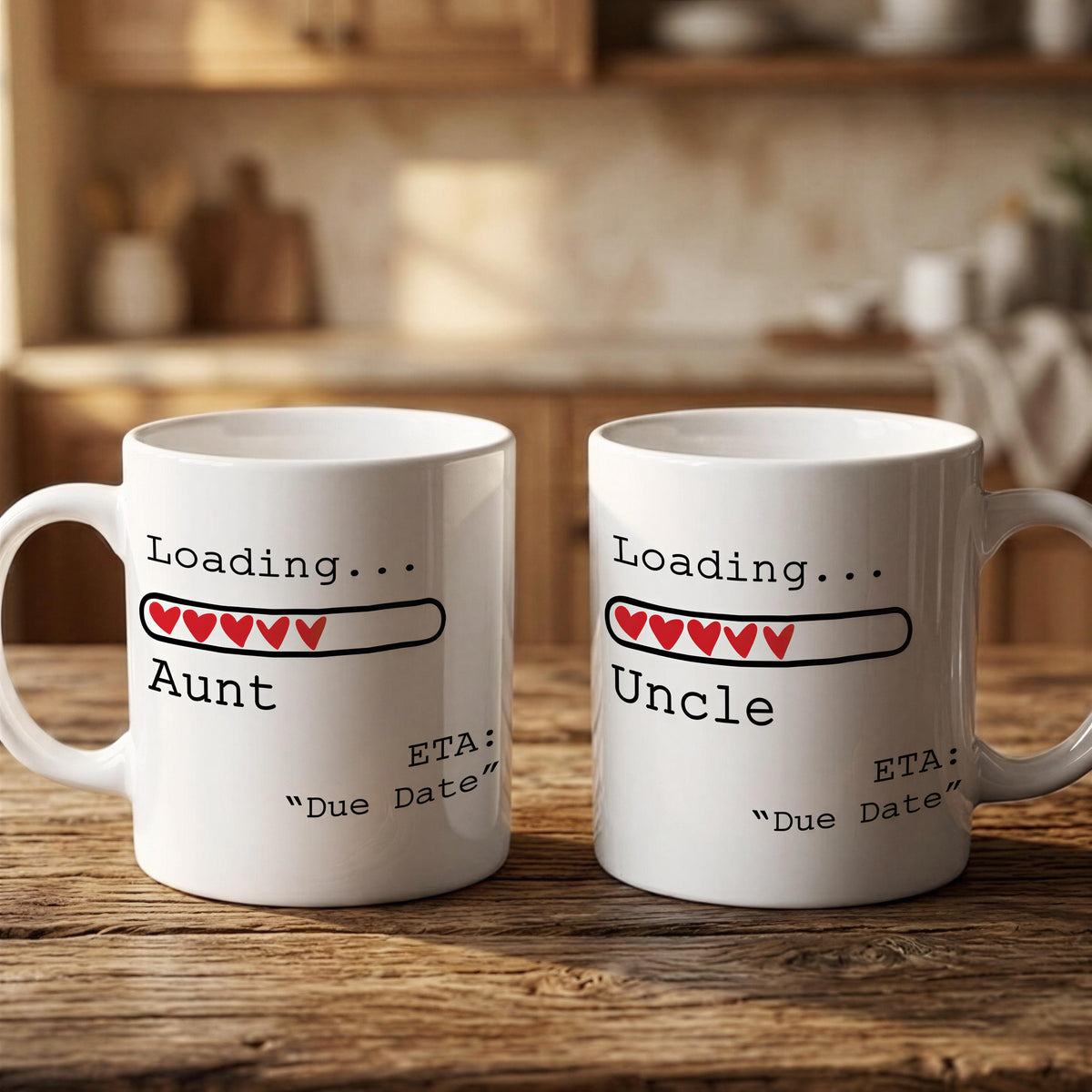 Two white mugs with text and graphics on them, placed on a wooden surface.