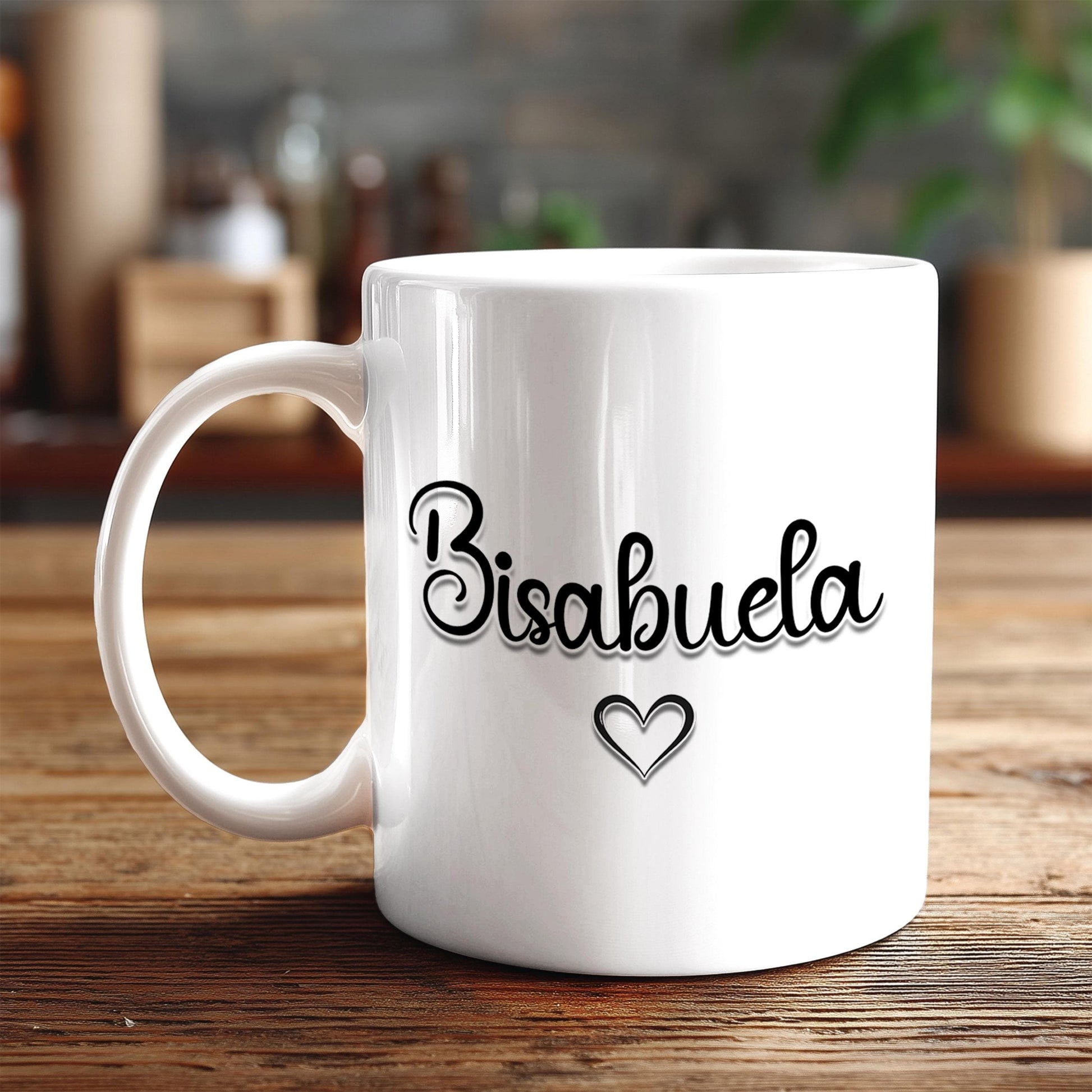 A white ceramic mug with the word "Bisabuela" printed on it, along with a heart symbol, sits on a wooden surface.