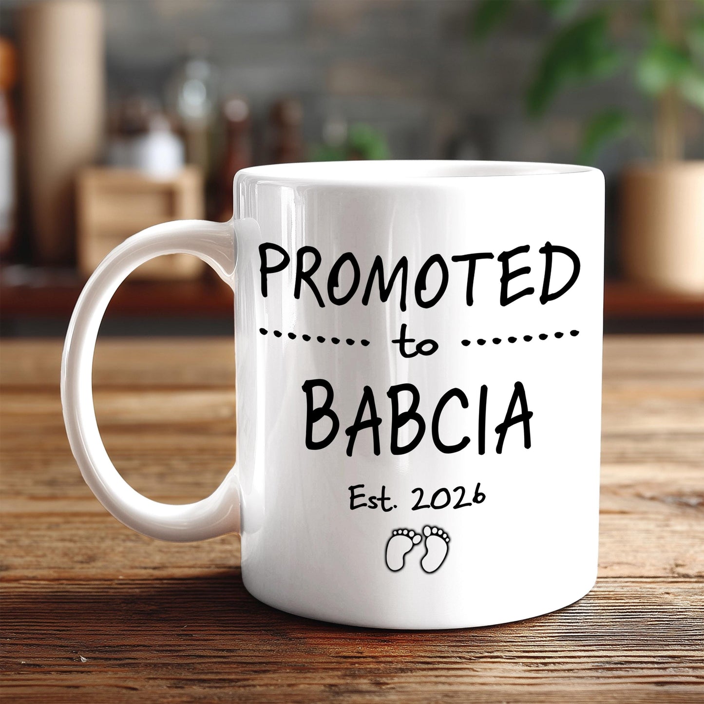 A white ceramic mug with black text and graphics on it, placed on a wooden surface.