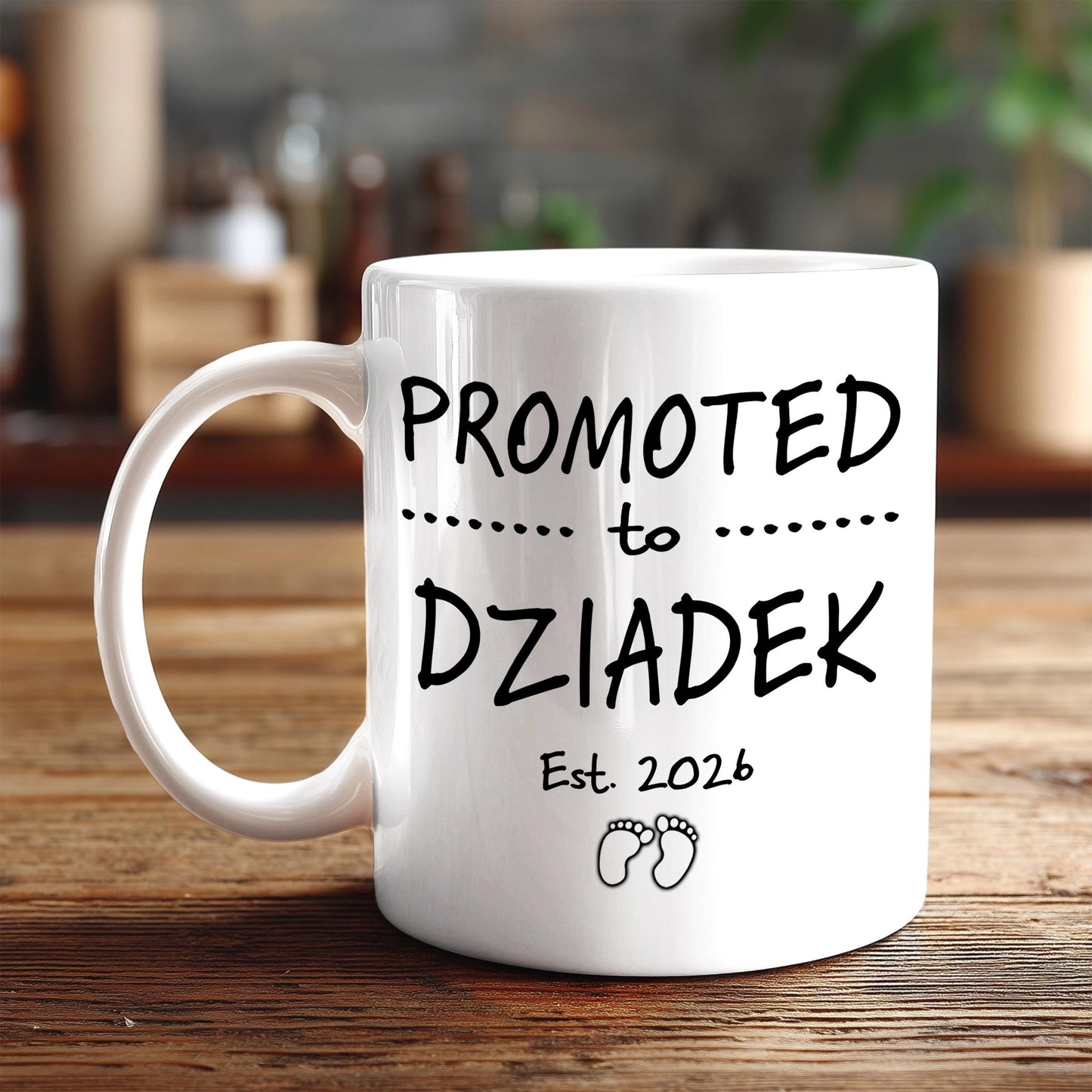 A white ceramic mug with black text and graphics on it, placed on a wooden surface.
