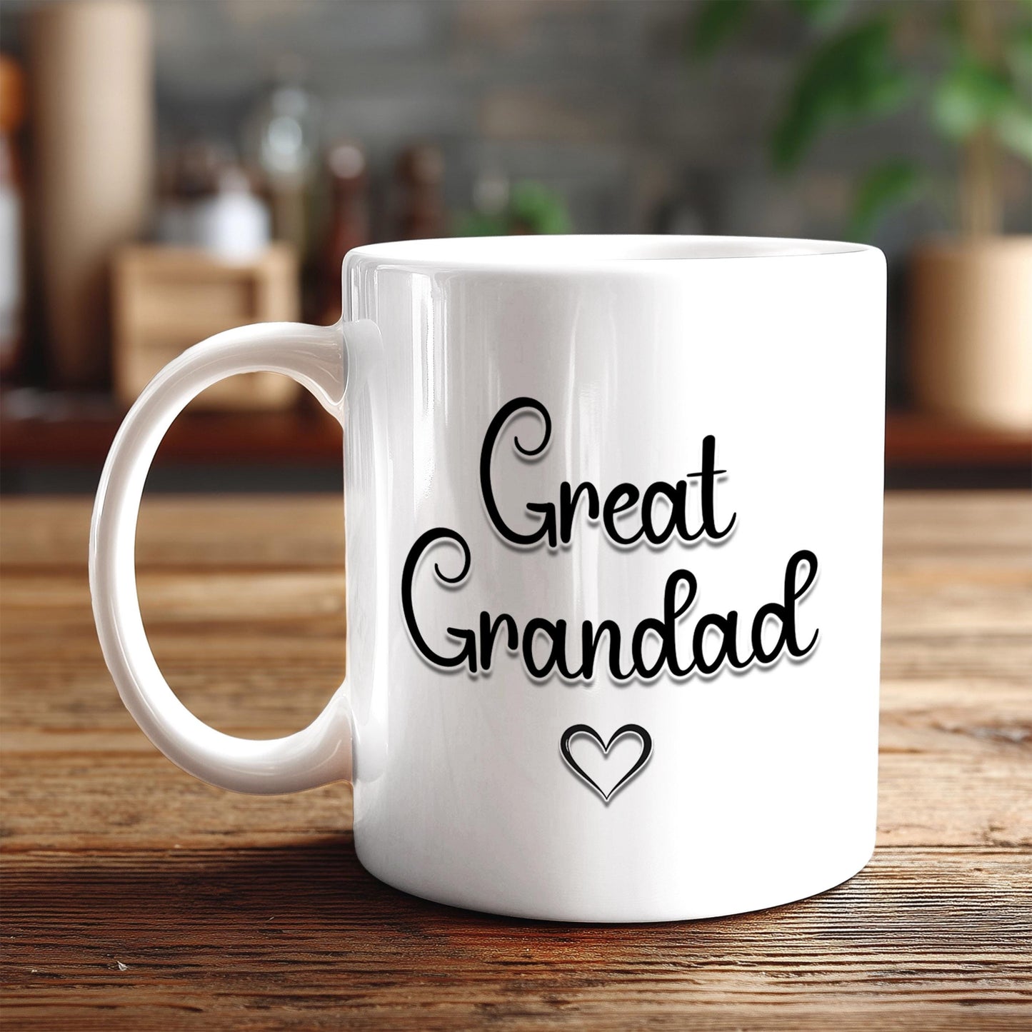 A white ceramic mug with the text "Great Grandad" printed on it, along with a heart symbol, sits on a wooden surface.