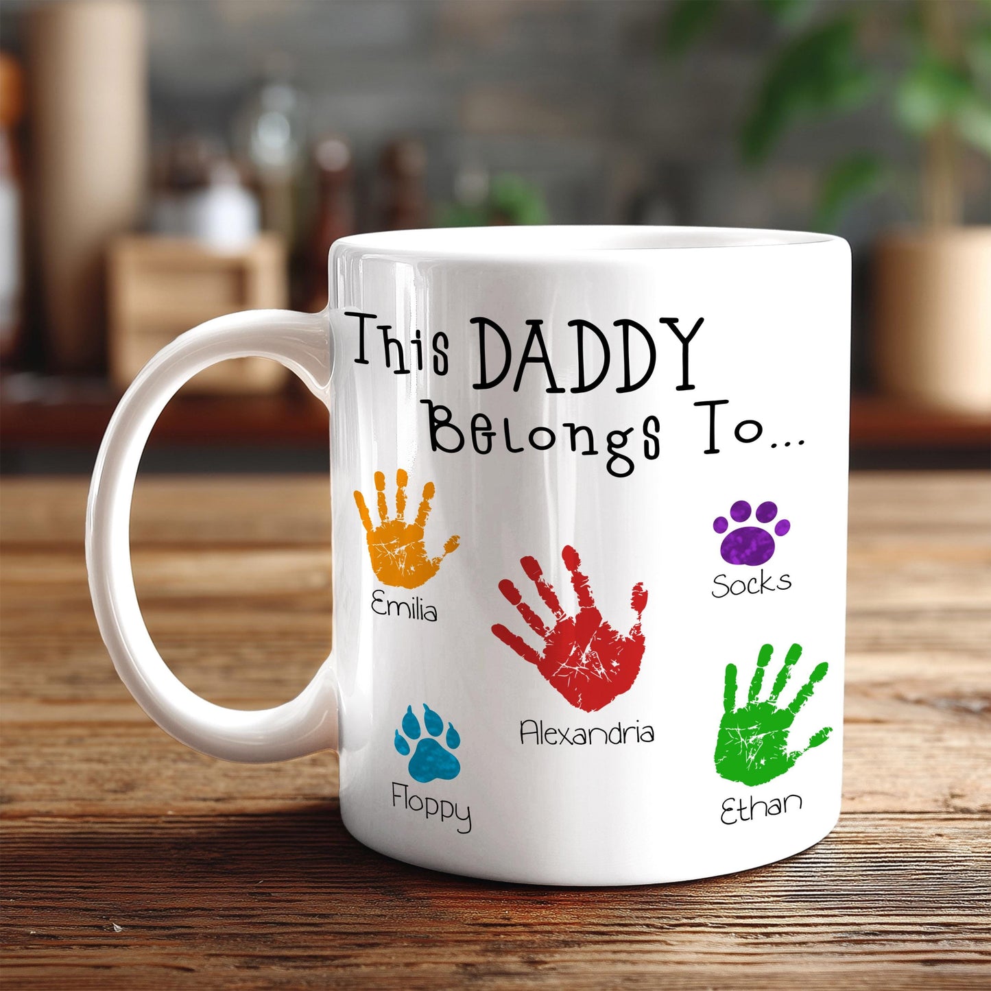 A white mug with a personalized message and handprints of the names of the children of the person who made the mug.