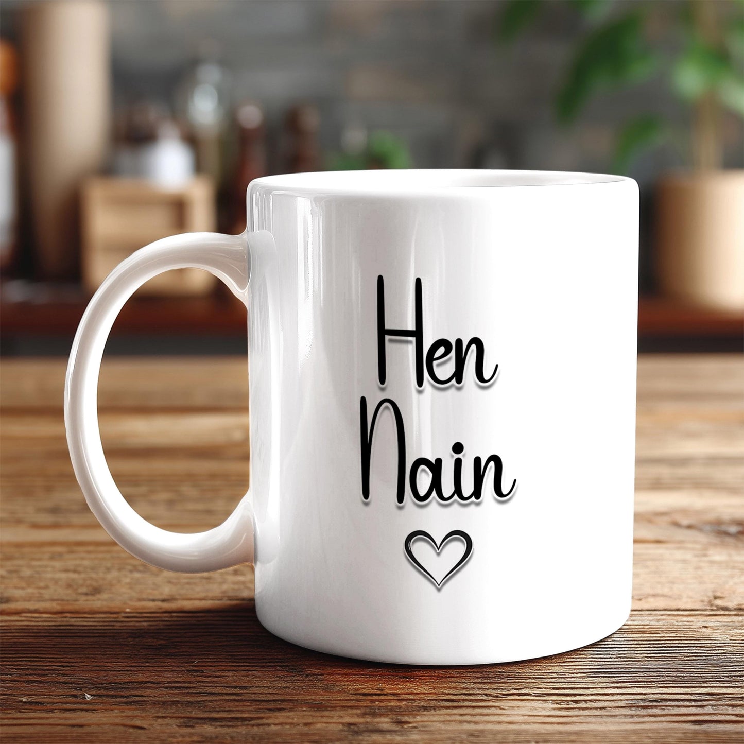 A white ceramic mug with the text "HEN NAIN" and a heart symbol printed on it, placed on a wooden surface.