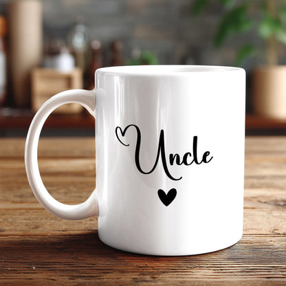 A white ceramic mug with the word "Uncle" printed on it, along with a heart symbol.