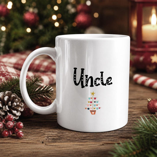 A white mug with the word "Uncle" printed on it, placed on a wooden surface with Christmas decorations in the background.