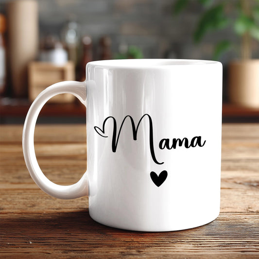 A white ceramic mug with the word "Mama" written on it in black cursive text.