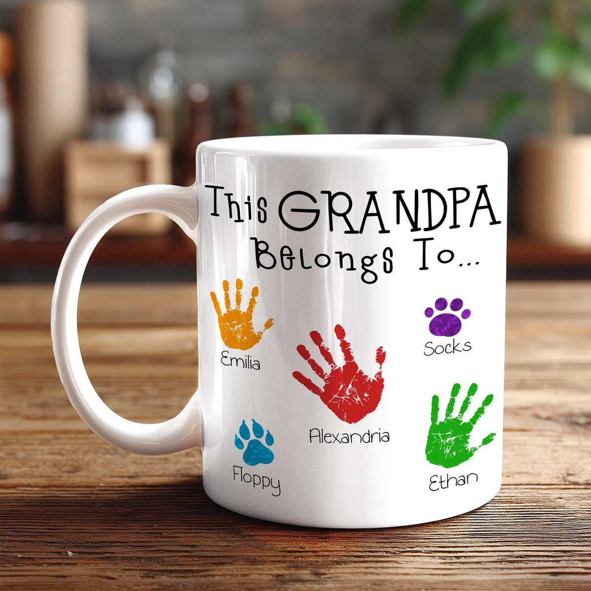 A white mug with a personalized message and handprint designs on it.