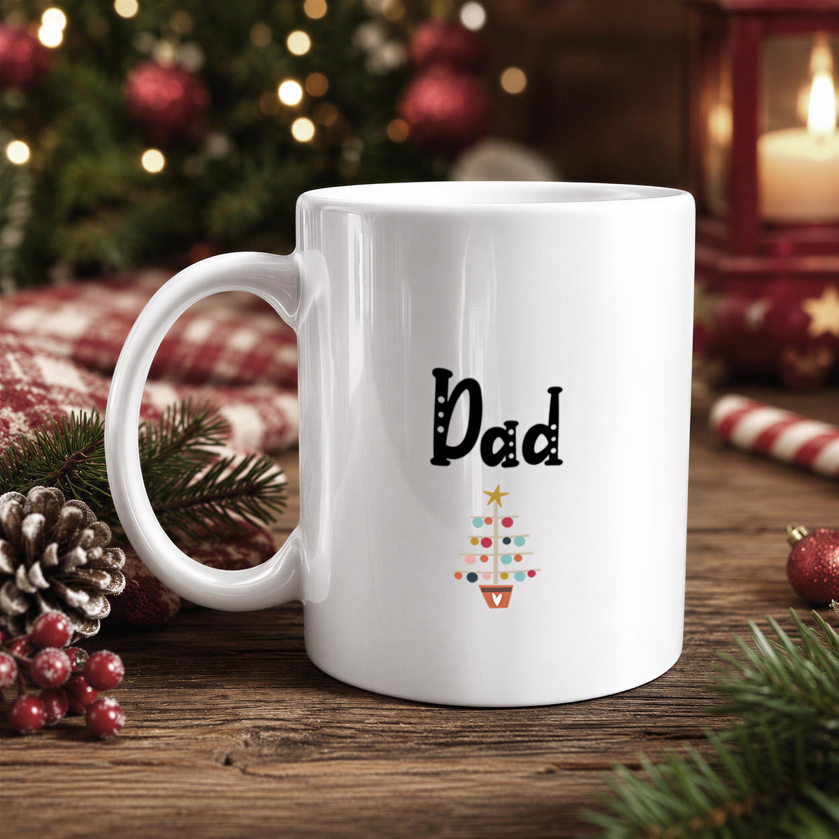 A white mug with the word "Dad" printed on it, placed on a wooden surface with Christmas decorations in the background.